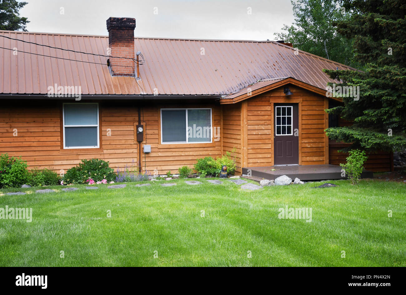 Front of rental cabin with cedar plank siding Stock Photo
