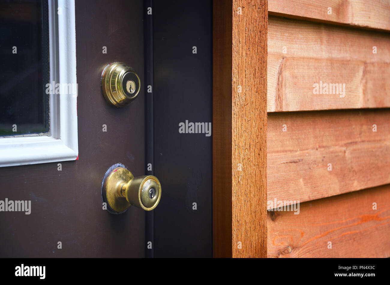 Door knob with keyhole and a deadbolt on a door Stock Photo - Alamy