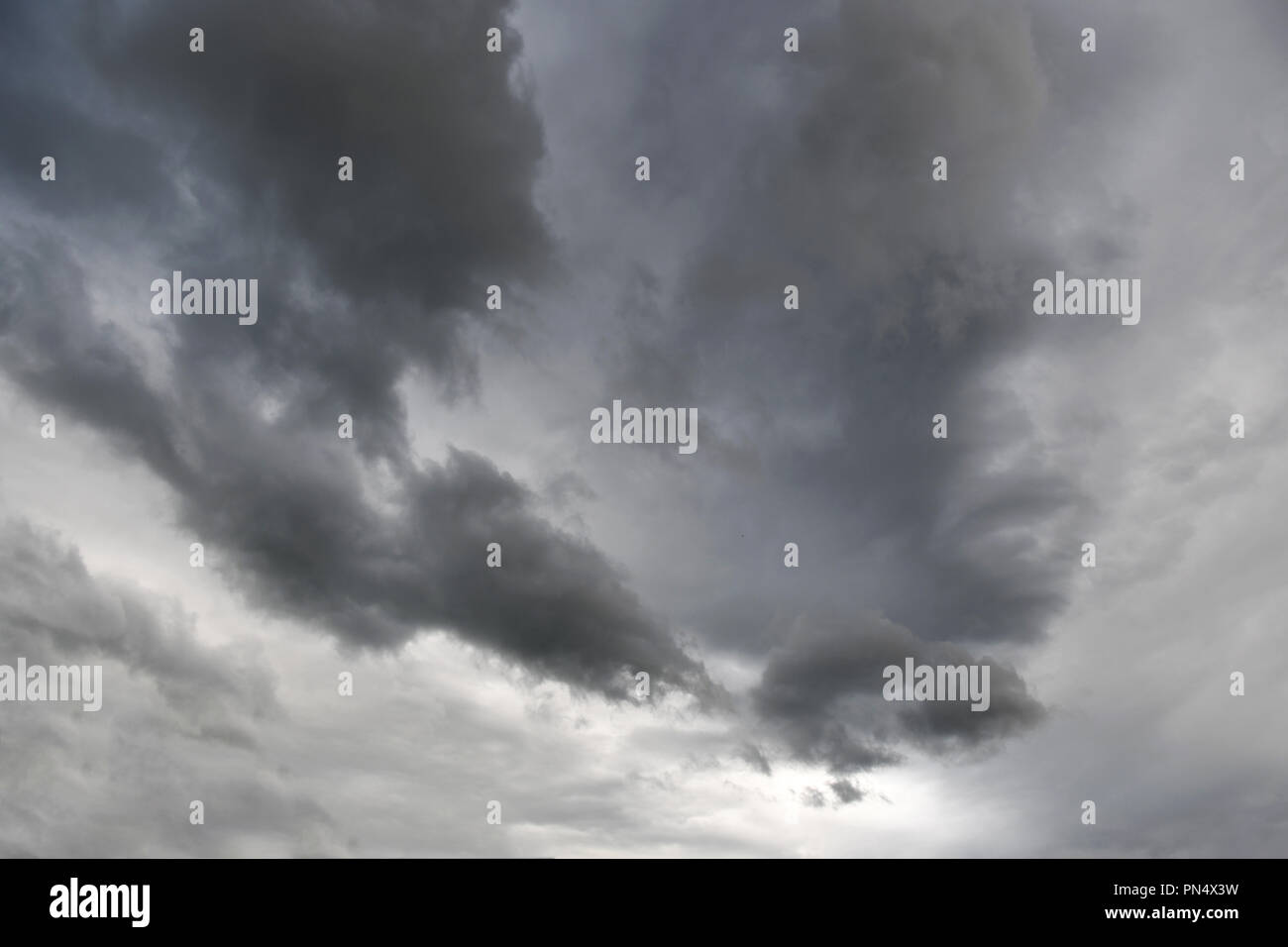 Dark gray storm clouds covering the sky Stock Photo