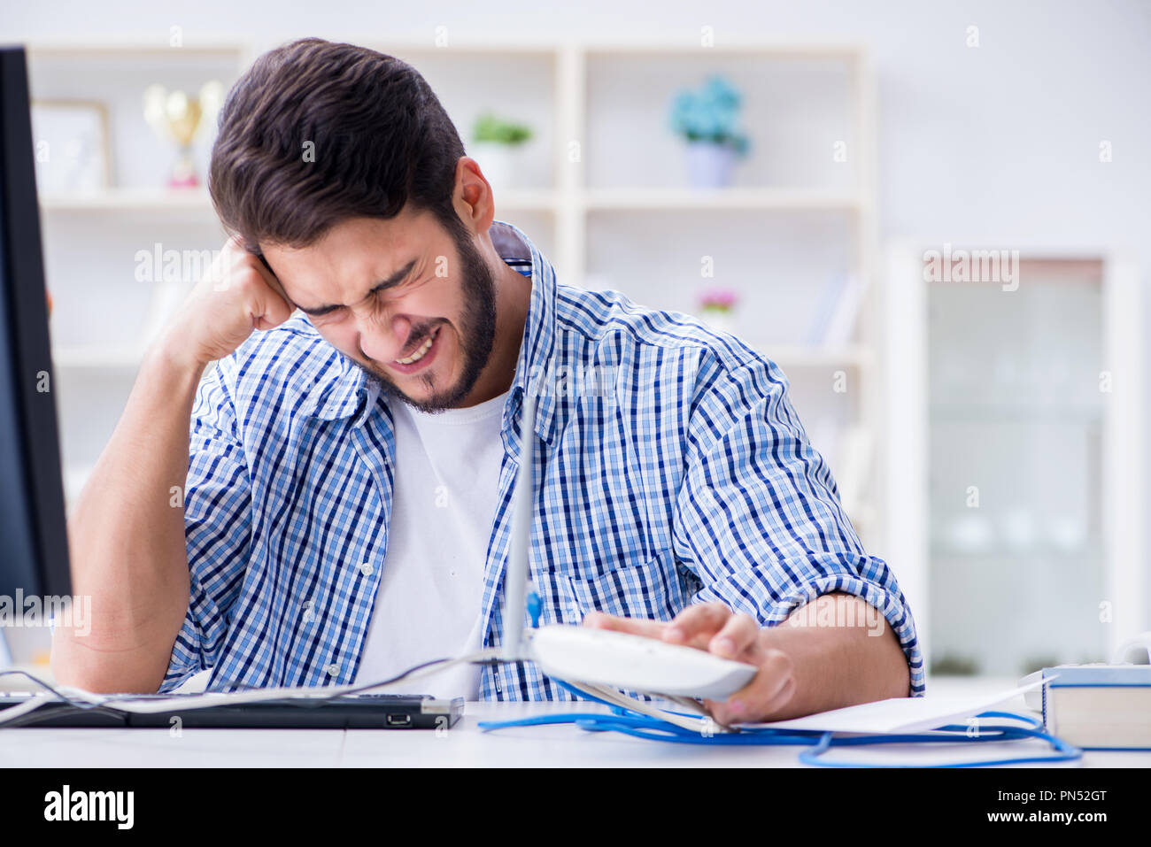 Frustrated young man due to weak internet reception Stock Photo - Alamy