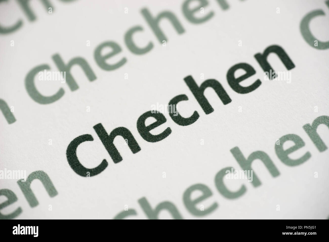 word Chechen language printed on white paper macro Stock Photo - Alamy
