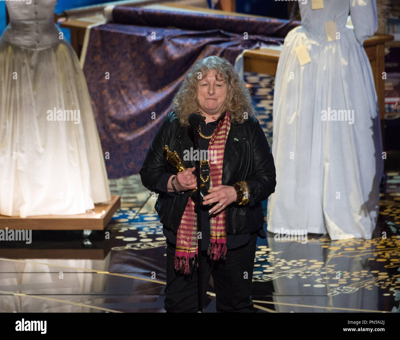 Jenny Beavan accepts the Oscar® for Achievement in costume design, for work on “Mad Max: Fury Road” during the live ABC Telecast of The 88th Oscars® at the Dolby® Theatre in Hollywood, CA on Sunday, February 28, 2016.  File Reference # 32854 502THA  For Editorial Use Only -  All Rights Reserved Stock Photo