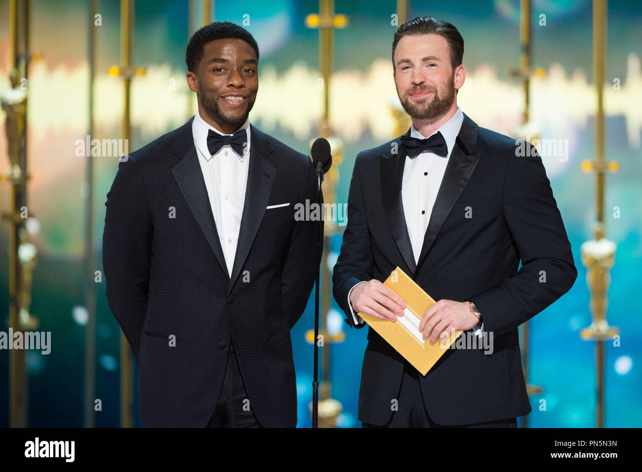 Chadwick Boseman (left) and Chris Evans (right) present the Oscar® for Achievement in sound editing, live ABC Telecast of The 88th Oscars® at the Dolby® Theatre in Hollywood, CA on Sunday, February 28, 2016.  File Reference # 32854 530THA  For Editorial Use Only -  All Rights Reserved Stock Photo