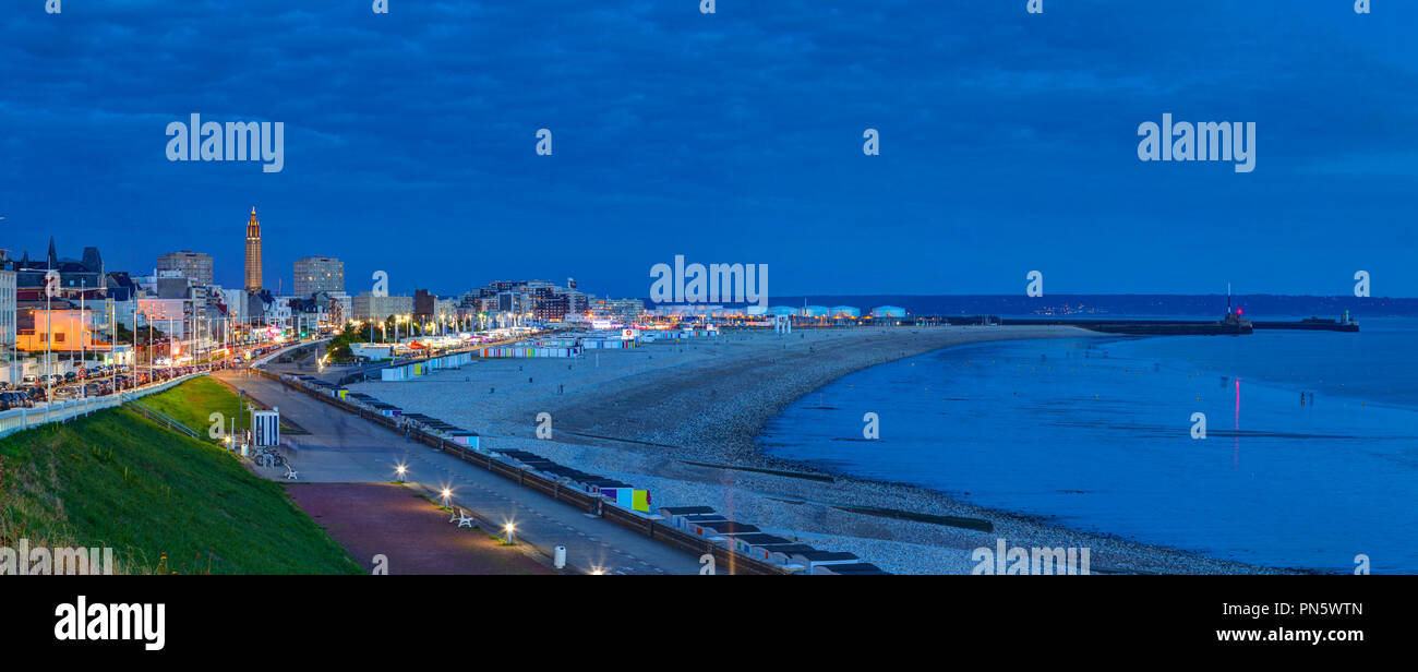 Le Havre: night view of the the waterfront, the beach, buildings and the Church of St Joseph with the commercial port in the background. Le Havre's re Stock Photo