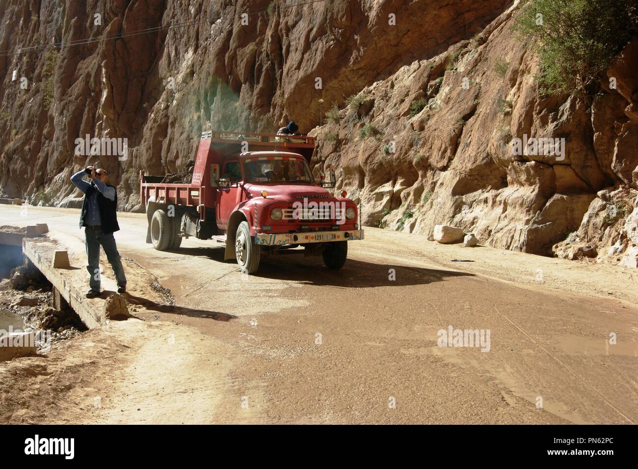 Bedford TJ tipper truck navigates the Todra Gorges, Morocco Stock Photo