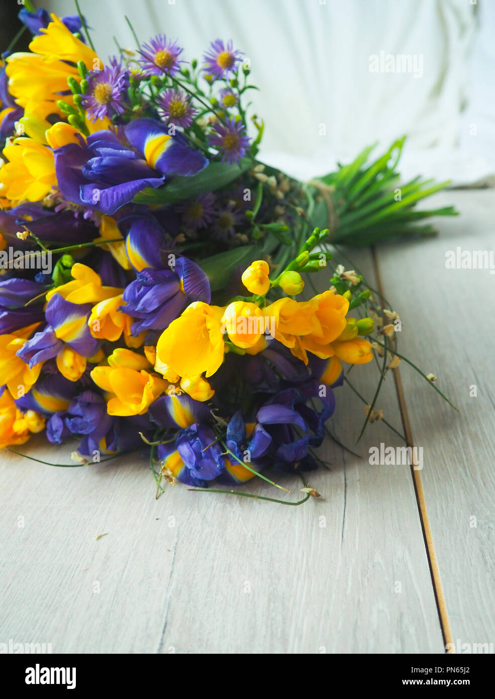 Beautiful flowers on a wood background, celebration, greeting card, space for text. Stock Photo