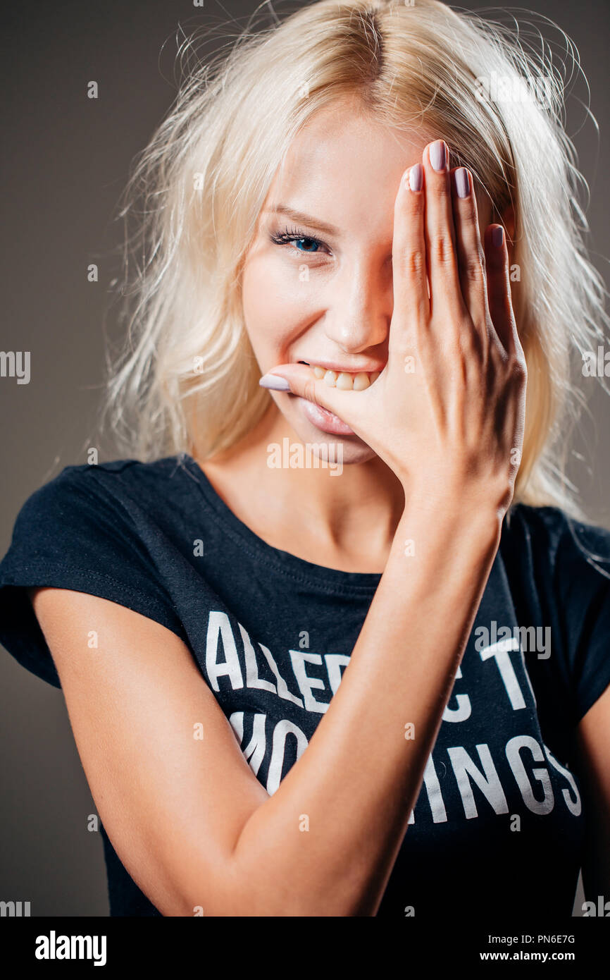 Beautiful woman with hand over eye, portrait. Stock Photo