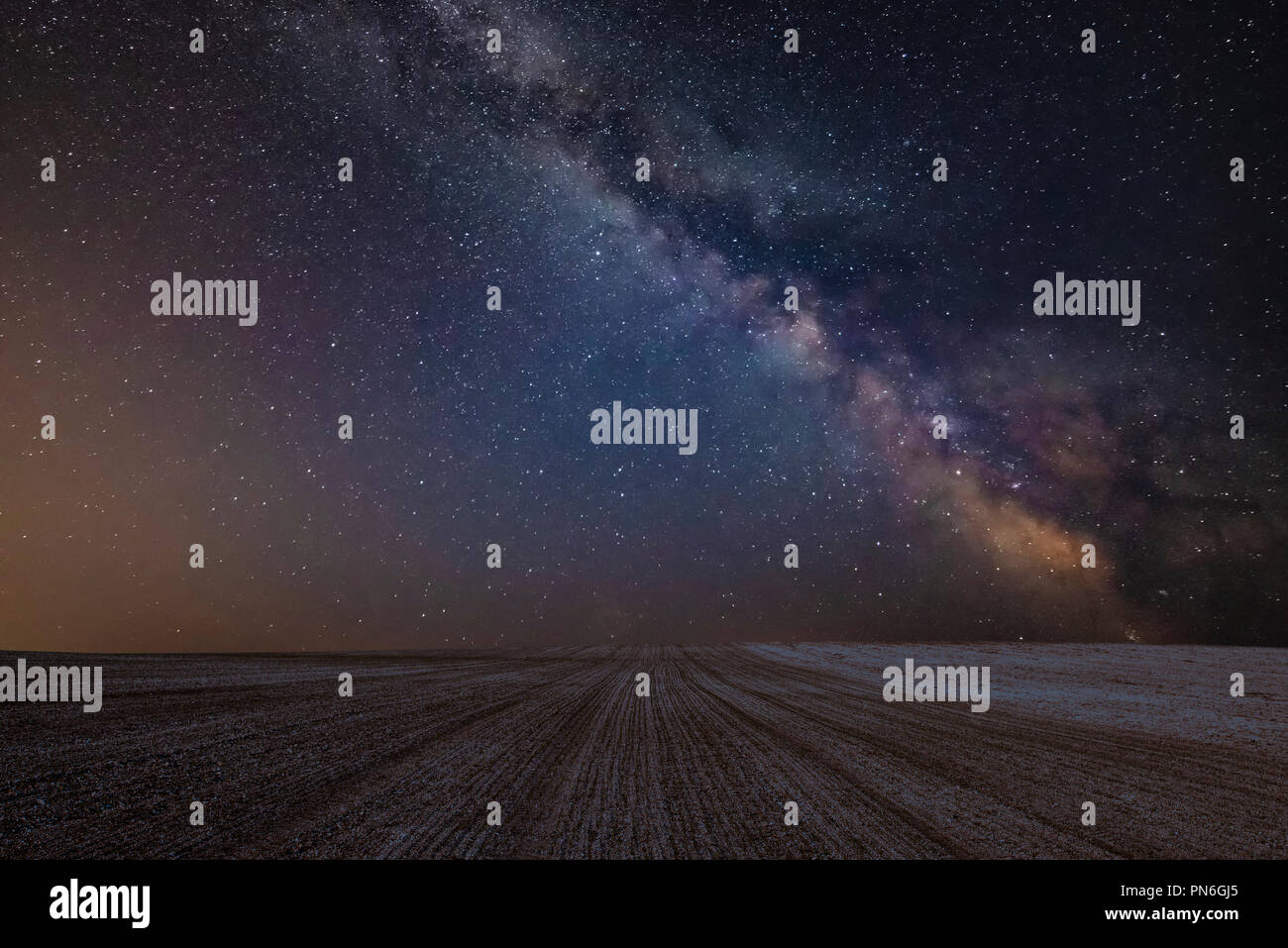 Stunning vibrant Milky Way composite image over landscape of cultivated ...