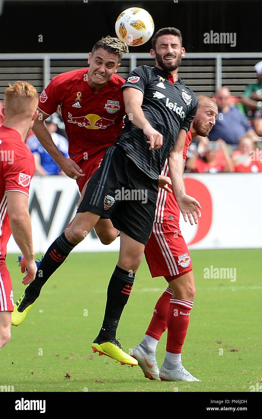 Washington, DC, USA. 16th Sep, 2018. 20180916 - D.C. United defender STEVE BIRNBAUM (15) battles for a head ball against New York Red Bulls defender AARON LONG (33), left, and New York Red Bulls midfielder DANIEL ROYER (77), back, in the first half at Audi Field in Washington. Credit: Chuck Myers/ZUMA Wire/Alamy Live News Stock Photo