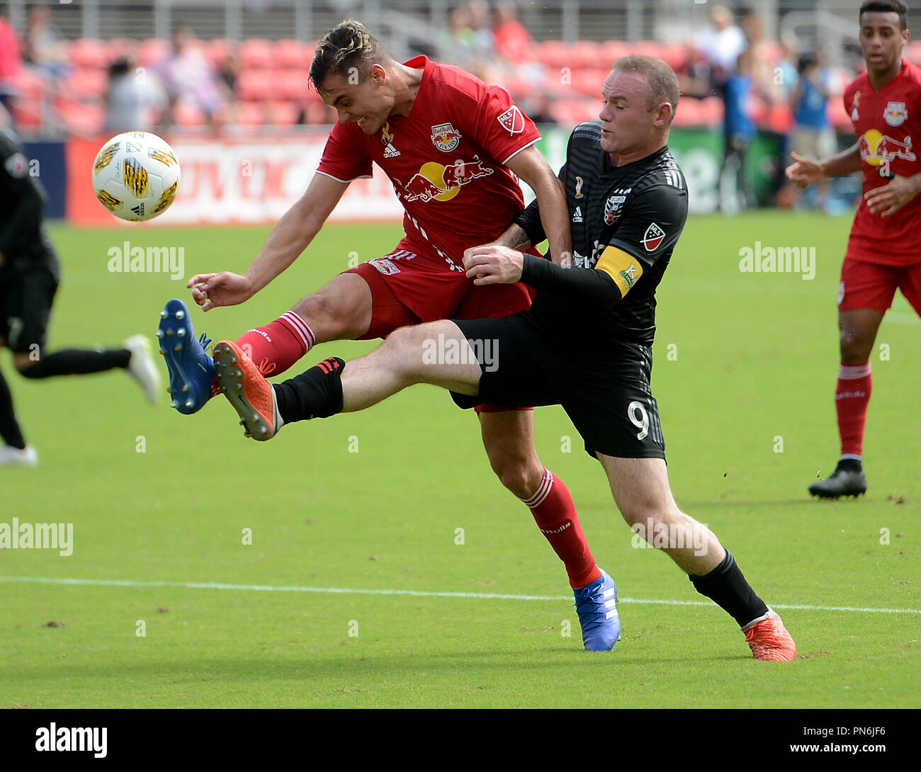Washington, DC, USA. 16th Sep, 2018. 20180916 - New York Red Bulls defender AARON LONG (33) defends D.C. United forward WAYNE ROONEY (9) in the first half at Audi Field in Washington. Credit: Chuck Myers/ZUMA Wire/Alamy Live News Stock Photo