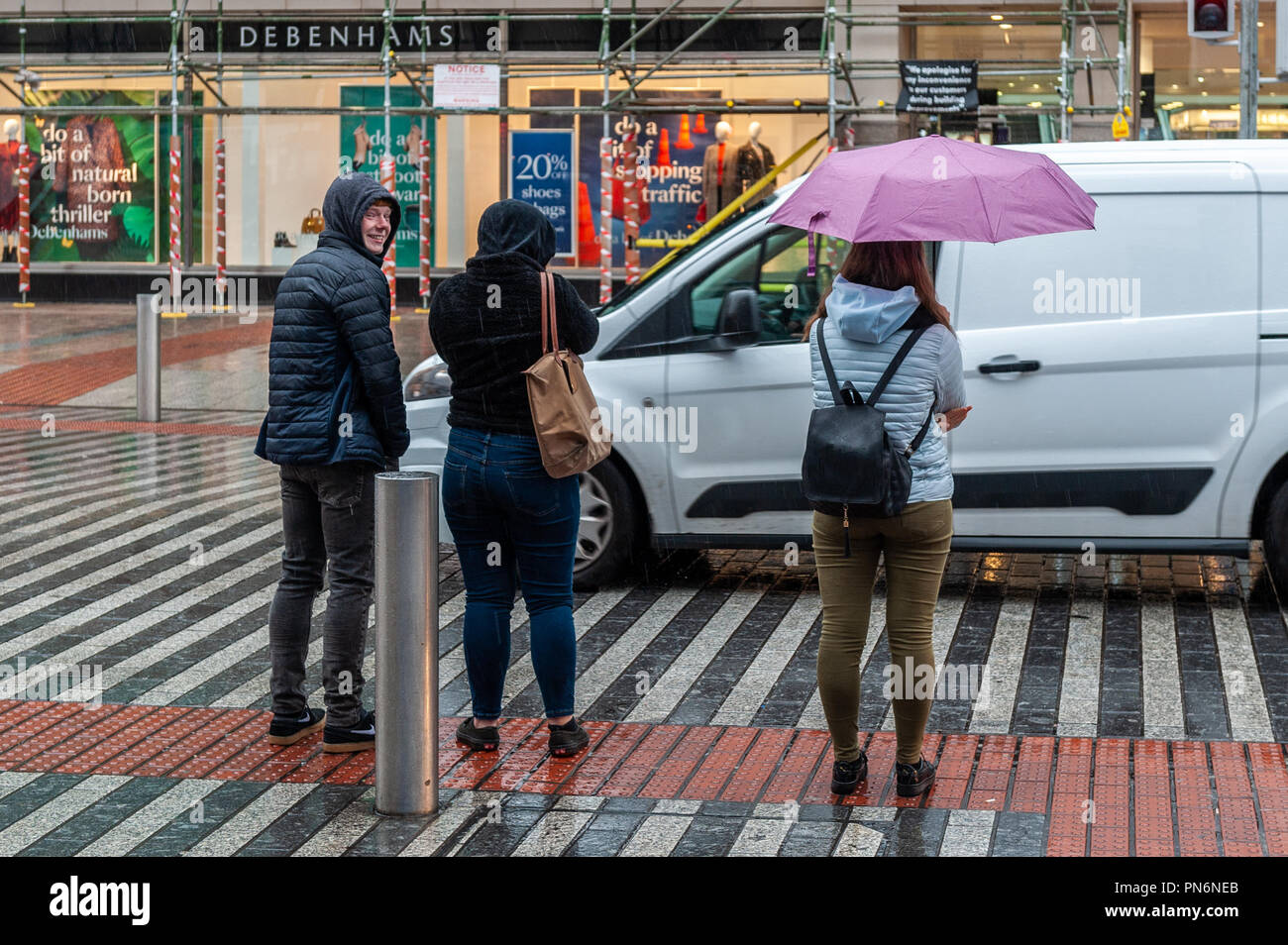 Cork, Ireland. 20th Sept, 2018. People hurry to their destination in
