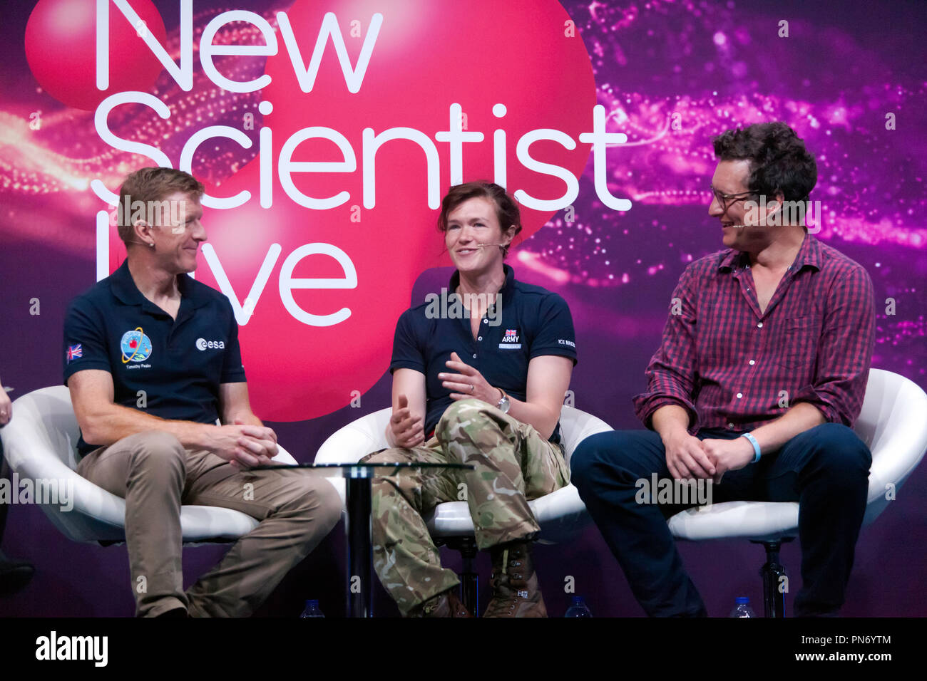 Astronaut Tim Peak and explorers Nics Wetherill and Will Millard participating in a talk about life in Space and the wild corners of Earth  on the main stage at New Scientist Live Stock Photo