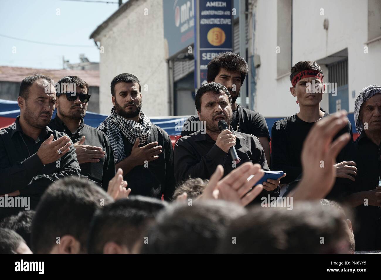 Piraeus, Greece. 20th Sep, 2018. A man seen speaking to Shia Muslims during the commemoration.Ashura commemoration, Muslims mourn the slaying of the Prophet Mohammed's grandson Imam Hussain, who was martyred along with his 72 companions in Karbala the city of Iraq in 680 AD. Credit: Giorgos Zachos/SOPA Images/ZUMA Wire/Alamy Live News Stock Photo