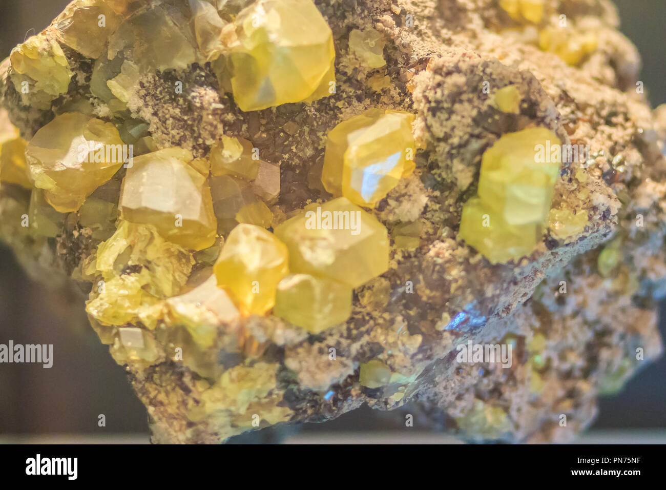 Sulphur crystal granular habit rock specimen from mining and quarrying. Sulfur or sulphur is a chemical element with symbol S and atomic number 16. It Stock Photo