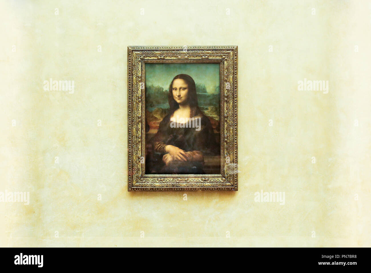 PARIS, FRANCE - MAY 01, 2018: Mona Lisa, La Joconde Leonardo da Vinci in white wall background in Louvre. Stock Photo