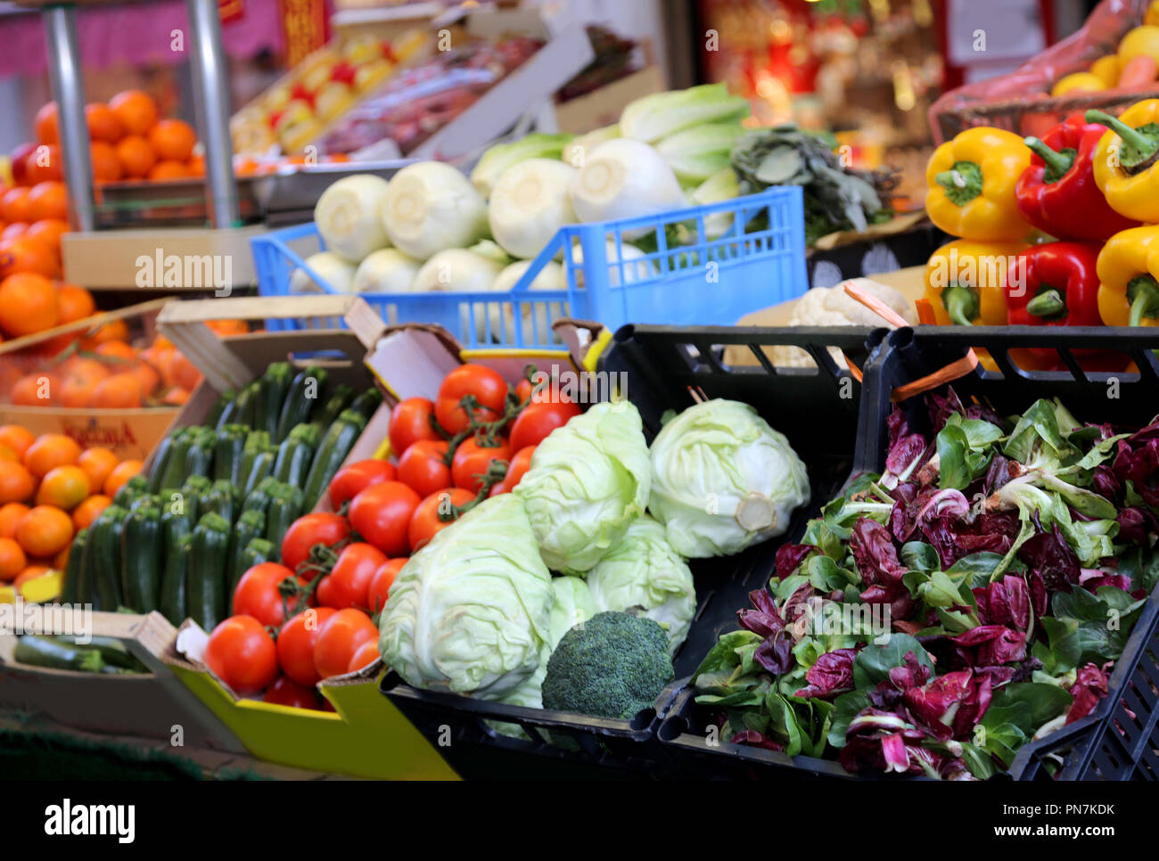 boxes filled with fresh fruit and vegetables for sale at a greengrocer ...