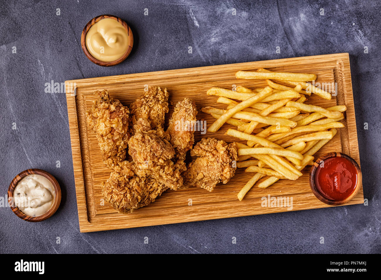 Fried chicken wings with french fries, top view Stock Photo - Alamy