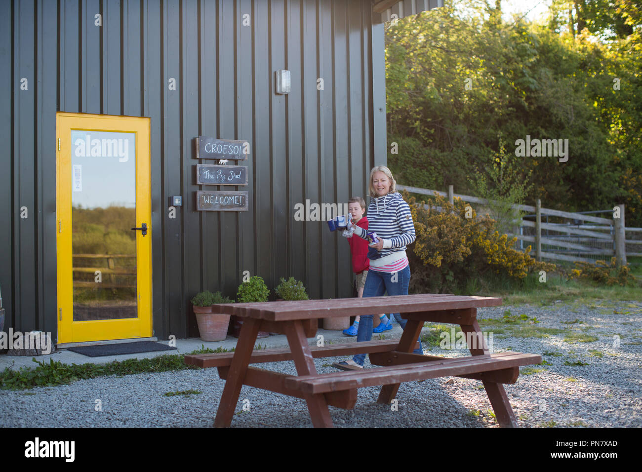 A mum and her son walking to the cook house in the morning Stock Photo ...