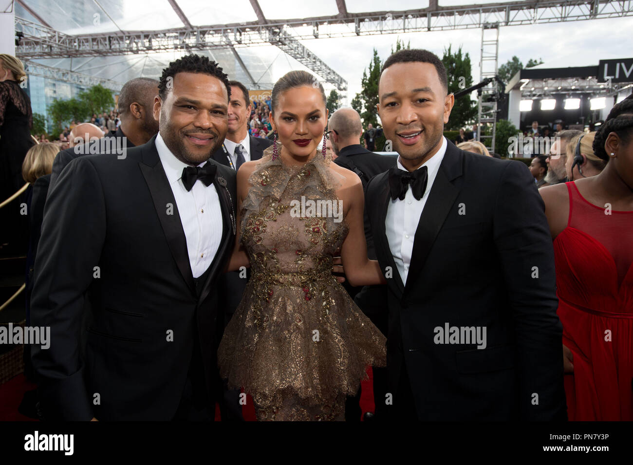 Nominated for BEST PERFORMANCE BY AN ACTOR IN A TELEVISION SERIES – COMEDY OR MUSICAL for his role in 'Black-ish,' actor Anthony Anderson, Chrissy Teigen, and John Legend attend the 74th Annual Golden Globes Awards at the Beverly Hilton in Beverly Hills, CA on Sunday, January 8, 2017.  File Reference # 33198 194JRC  For Editorial Use Only -  All Rights Reserved Stock Photo