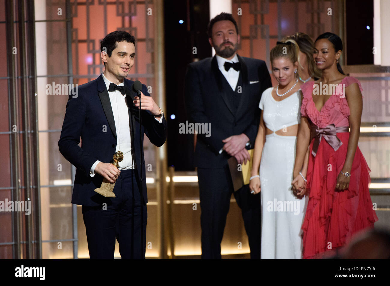 The Golden Globe is awarded to Damien Chazelle for BEST DIRECTOR – MOTION PICTURE for 'La La Land' at the 74th Annual Golden Globe Awards at the Beverly Hilton in Beverly Hills, CA on Sunday, January 8, 2017.  File Reference # 33198 529JRC  For Editorial Use Only -  All Rights Reserved Stock Photo