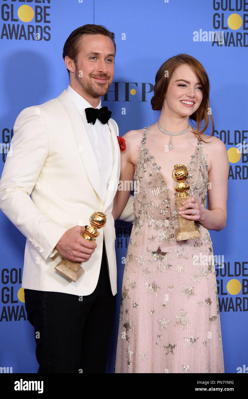 Golden Globe winners Ryan Gosling and Emma Stone for their performances in 'La La Land' pose backstage in the press room with her Golden Globe Award at the 74th Annual Golden Globe Awards at the Beverly Hilton in Beverly Hills, CA on Sunday, January 8, 2017.  File Reference # 33198 578JRC  For Editorial Use Only -  All Rights Reserved Stock Photo