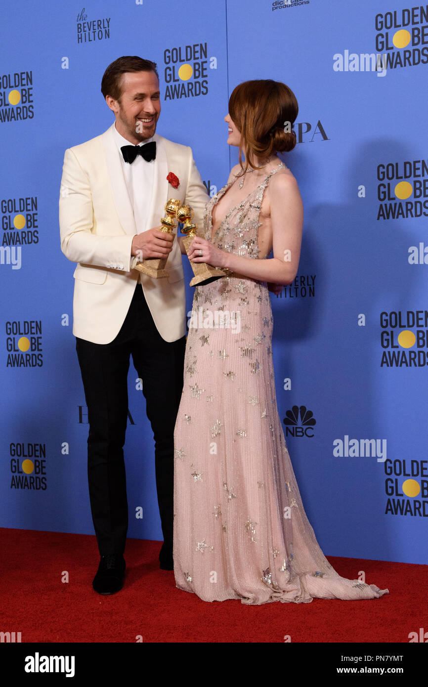 Golden Globe winners Ryan Gosling and Emma Stone for their performances in 'La La Land' pose backstage in the press room with her Golden Globe Award at the 74th Annual Golden Globe Awards at the Beverly Hilton in Beverly Hills, CA on Sunday, January 8, 2017.  File Reference # 33198 585JRC  For Editorial Use Only -  All Rights Reserved Stock Photo