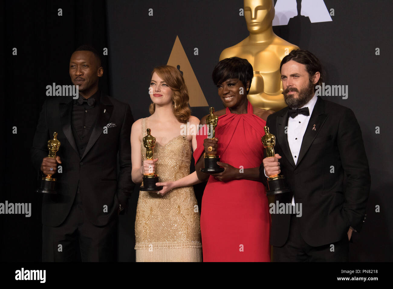 Backstage posing with their Oscars®, Mahershala Ali, Actor in a Supporting Role; Emma Stone, Actress in a Leading Role; Viola Davis, Actress in a Supporting Role; and Casey Affleck, Actor in a Leading Role backstage during The 89th Oscars® at the Dolby® Theatre in Hollywood, CA on Sunday, February 26, 2017.  File Reference # 33242 551THA  For Editorial Use Only -  All Rights Reserved Stock Photo