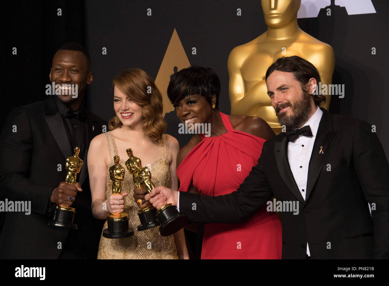 Backstage posing with their Oscars®, Mahershala Ali, Actor in a Supporting Role; Emma Stone, Actress in a Leading Role; Viola Davis, Actress in a Supporting Role; and Casey Affleck, Actor in a Leading Role backstage during The 89th Oscars® at the Dolby® Theatre in Hollywood, CA on Sunday, February 26, 2017.  File Reference # 33242 552THA  For Editorial Use Only -  All Rights Reserved Stock Photo