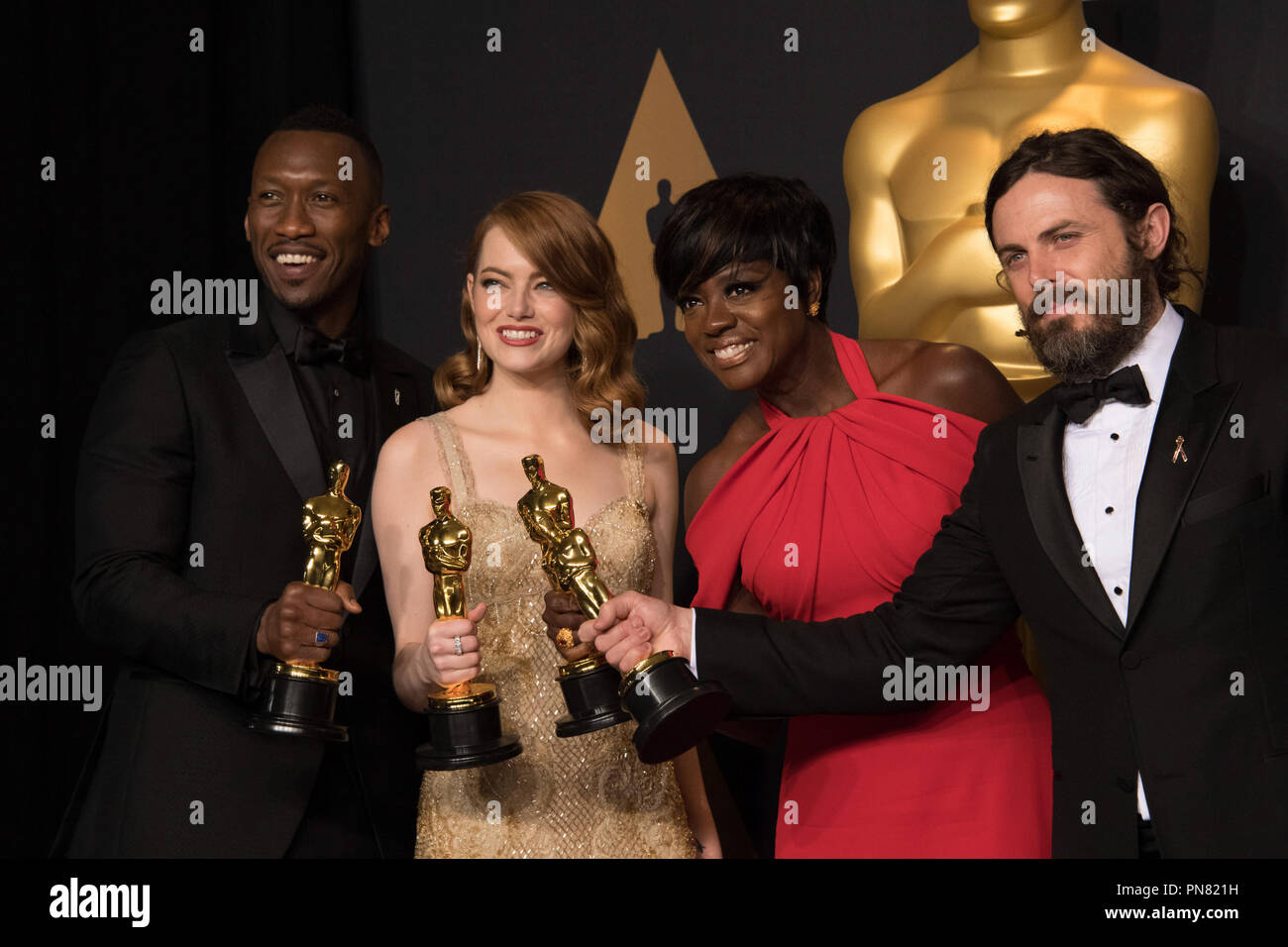 Backstage posing with their Oscars®, Mahershala Ali, Actor in a Supporting Role; Emma Stone, Actress in a Leading Role; Viola Davis, Actress in a Supporting Role; and Casey Affleck, Actor in a Leading Role backstage during The 89th Oscars® at the Dolby® Theatre in Hollywood, CA on Sunday, February 26, 2017.  File Reference # 33242 553THA  For Editorial Use Only -  All Rights Reserved Stock Photo
