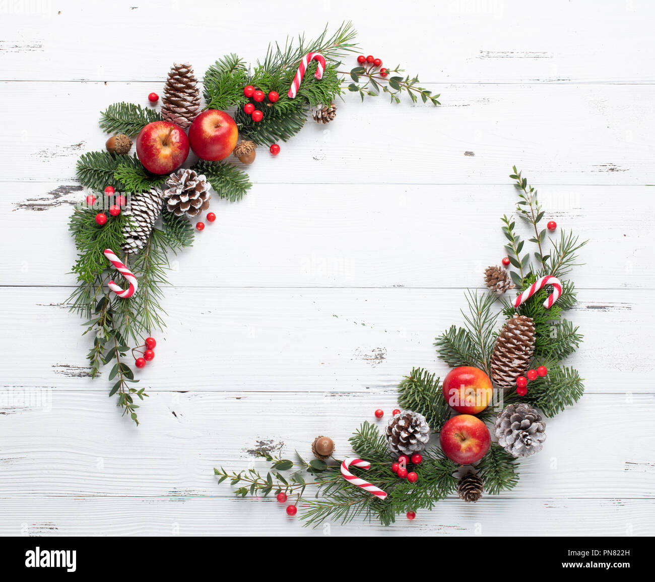 Fir tree branch with cones,apples and berries Stock Photo