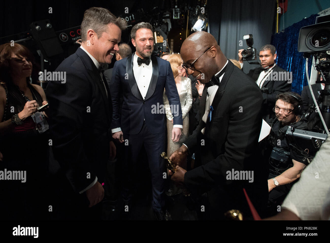 Oscar® nominee Matt Damon and Ben Affleck congratulate Barry Jenkins backstage after he accepted the Oscar® for Adapted screenplay, for work on “Moonlight” during the live ABC Telecast of The 89th Oscars® at the Dolby® Theatre in Hollywood, CA on Sunday, February 26, 2017.  File Reference # 33242 630THA  For Editorial Use Only -  All Rights Reserved Stock Photo