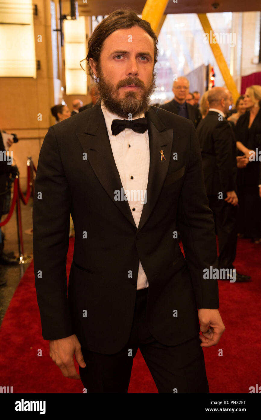 Caylee Cowan, left, and Casey Affleck arrive at the amfAR Gala Los