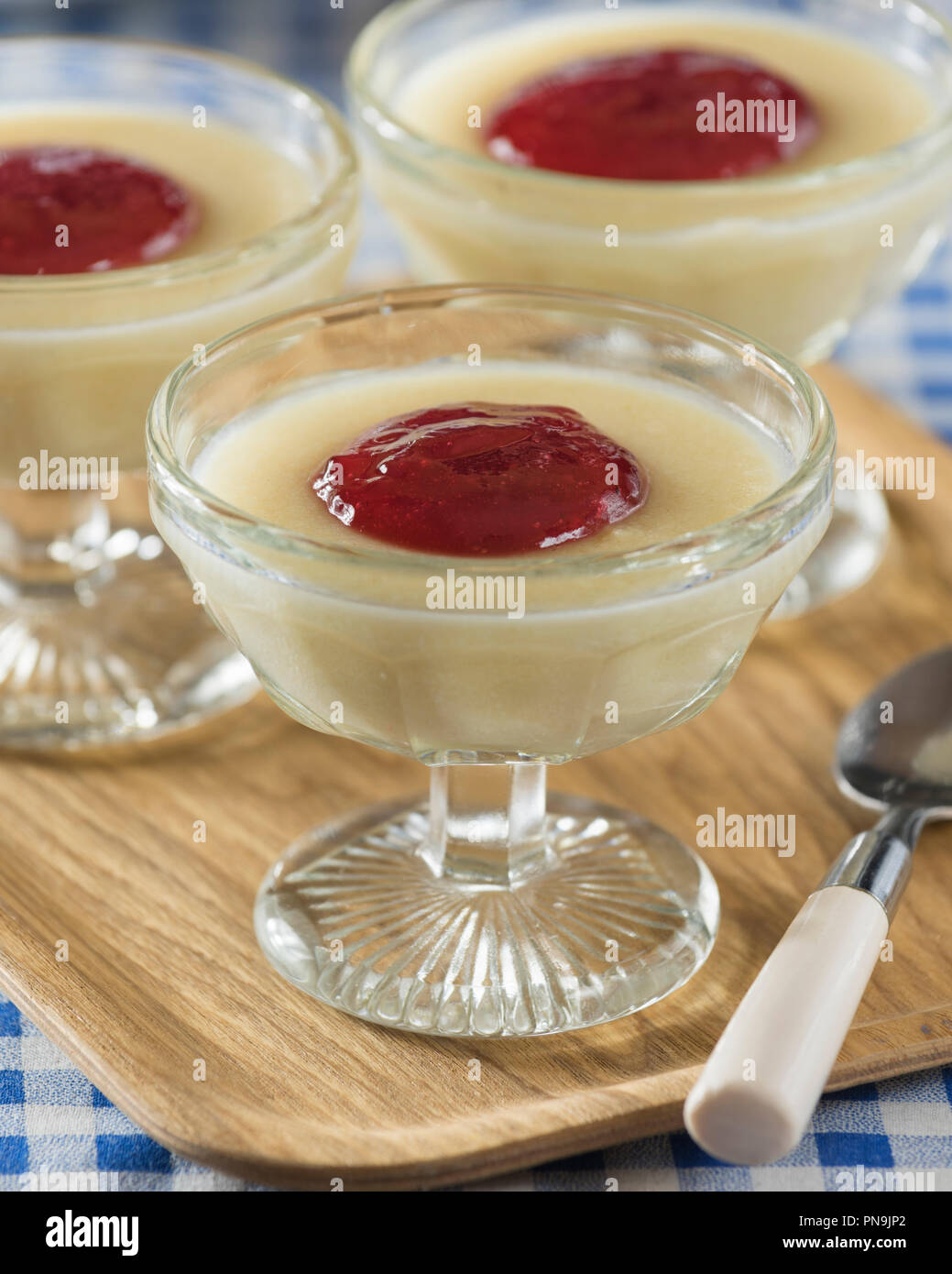 Semolina pudding with jam. Traditional dessert. Food UK Stock Photo