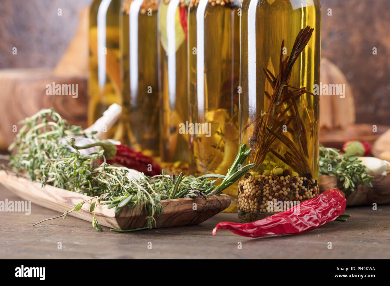 Bottles of olive oil on a old wooden table. Olive oil with different