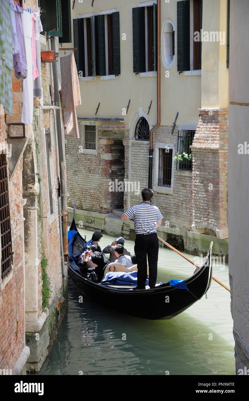 Gondola passing through narrow canal hi-res stock photography and ...