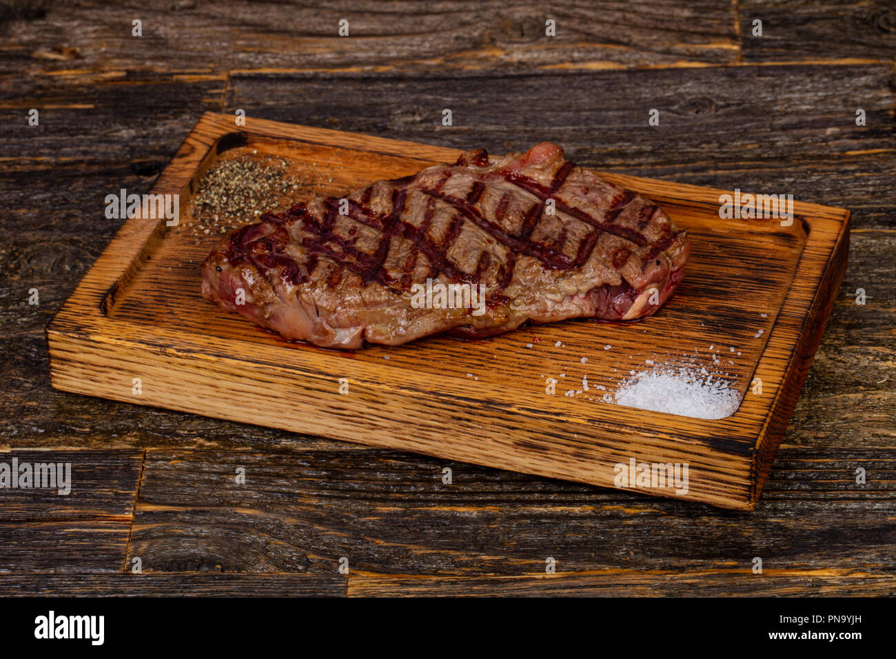 Grilled strip loin steak with salt and pepper Stock Photo Alamy