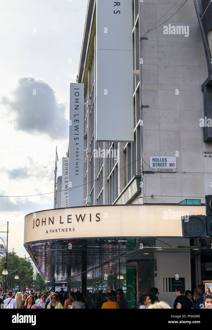 Entrance sign and canopy outside the flagship John Lewis & Partners department store in Oxford Street in the West End shopping area of central London Stock Photo