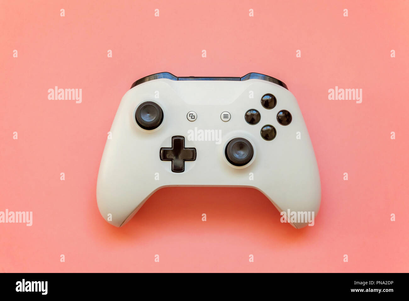 White joystick gamepad, game console on pink colourful trendy modern ...