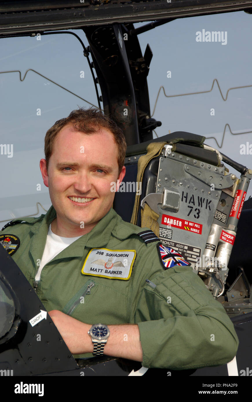 Pilot Matt Barker RAF Royal Air Force solo BAe Hawk air display pilot sitting in the cockpit of a Hawk T1 with ejector seat canopy with detonator cord Stock Photo