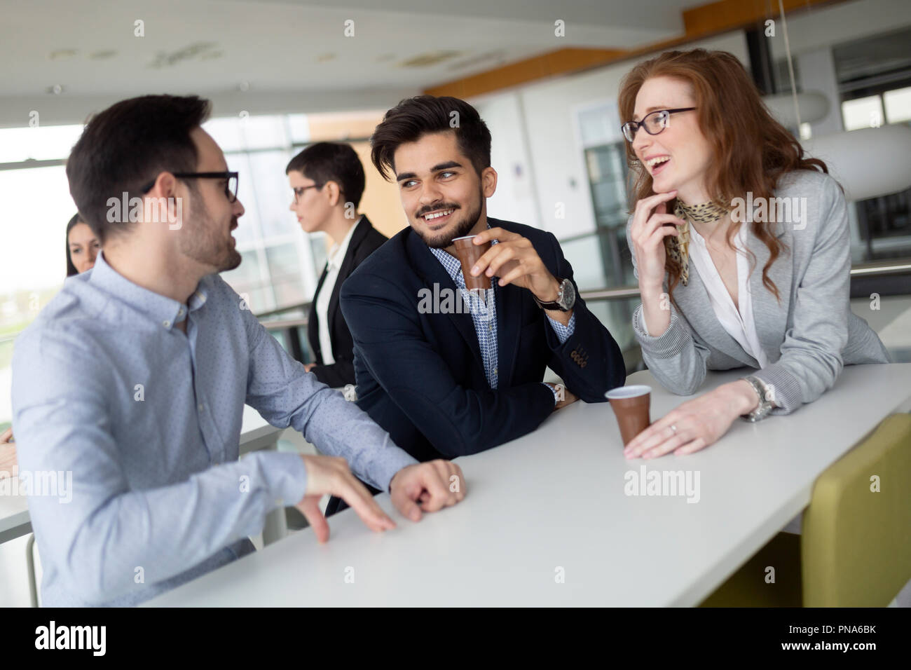 Business colleagues having conversation during coffee break Stock Photo