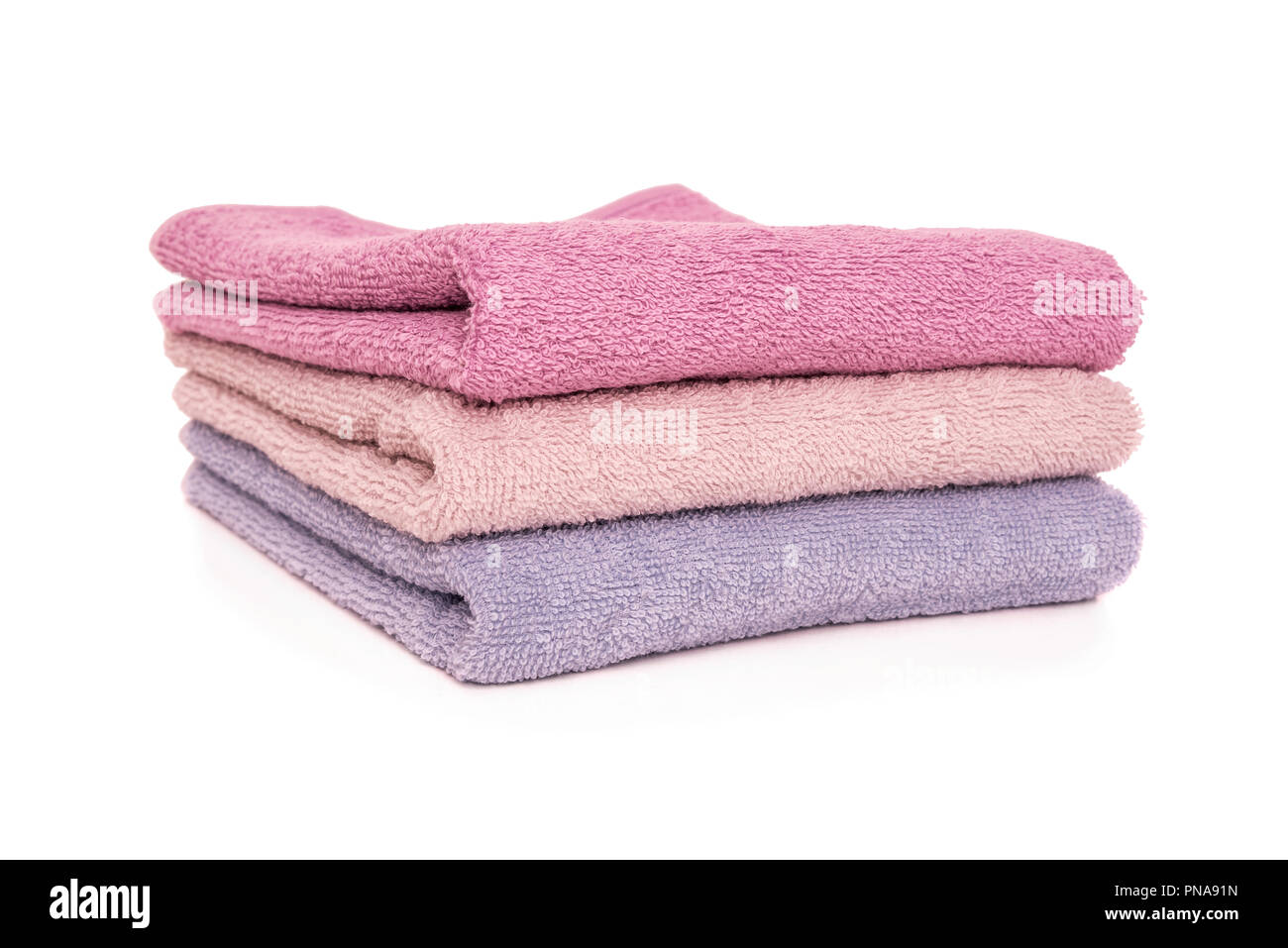 Terry towels. They are stacked vertically on top of each other. Stock Photo