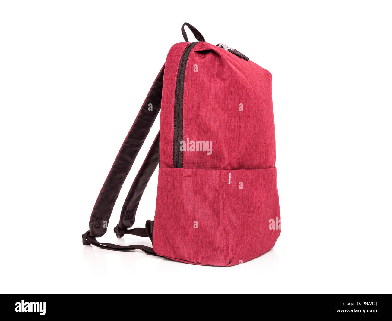 Red sporty backpack on a white background. Stock Photo
