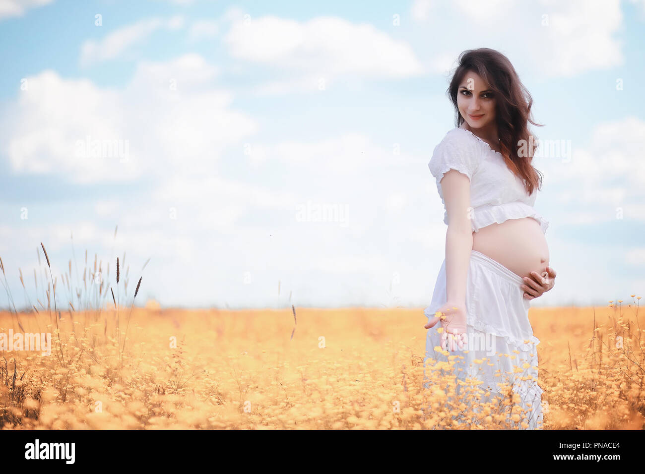 Pregnant woman in nature for a walk in the autumn Stock Photo - Alamy