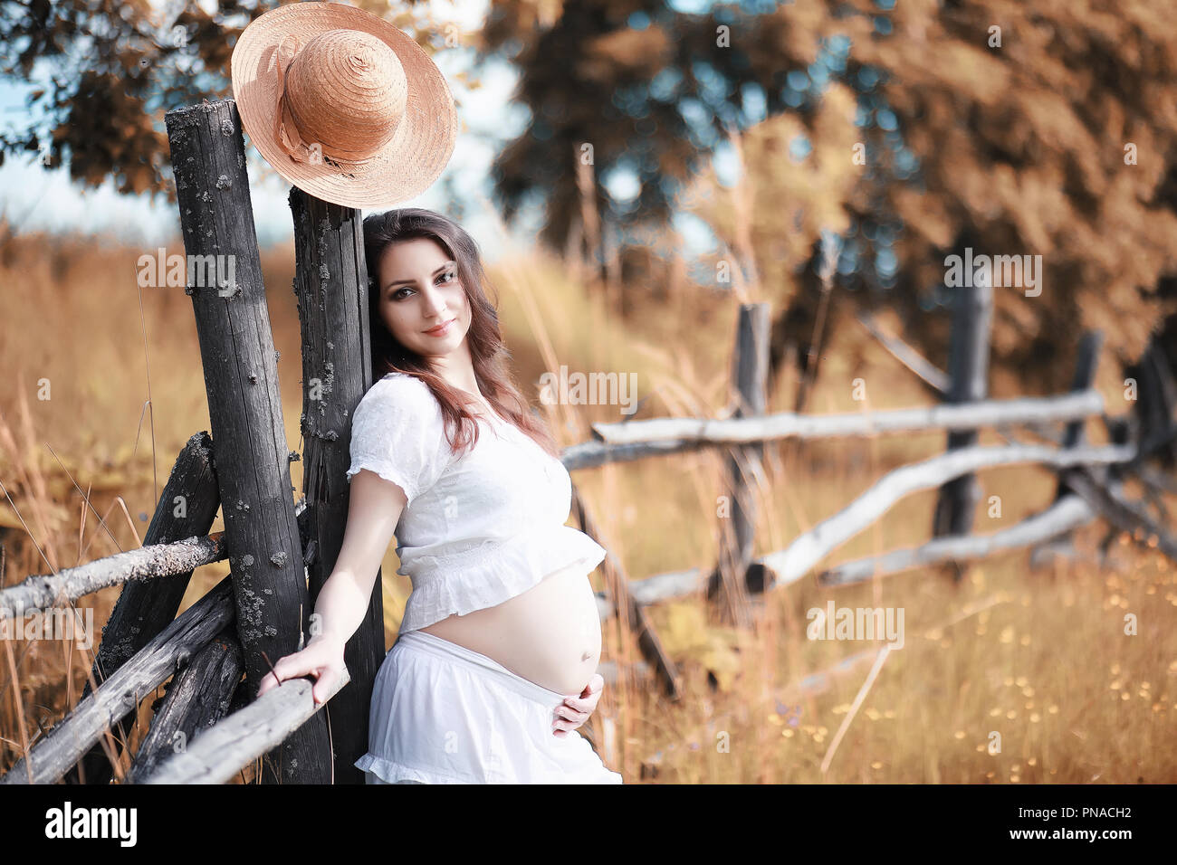 Pregnant woman in nature for a walk in the autumn Stock Photo - Alamy