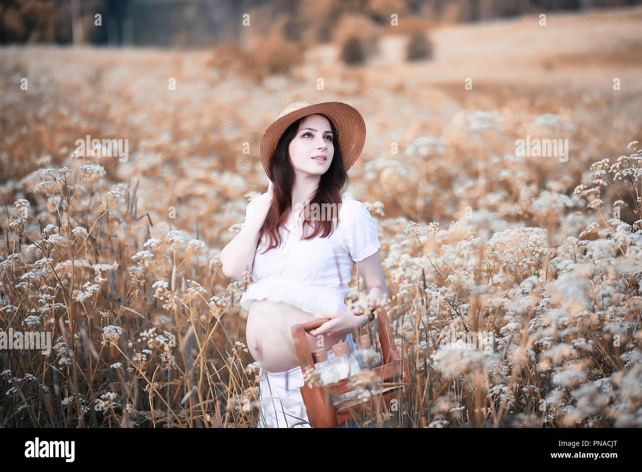 Pregnant woman in nature for a walk in the autumn Stock Photo - Alamy