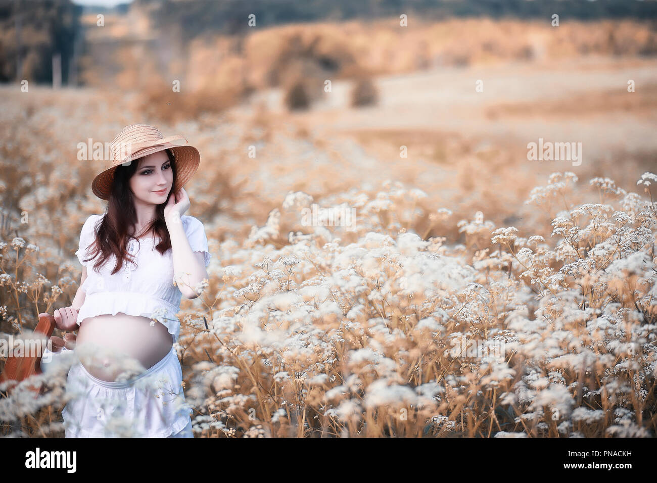 Pregnant woman in nature for a walk in the autumn Stock Photo - Alamy