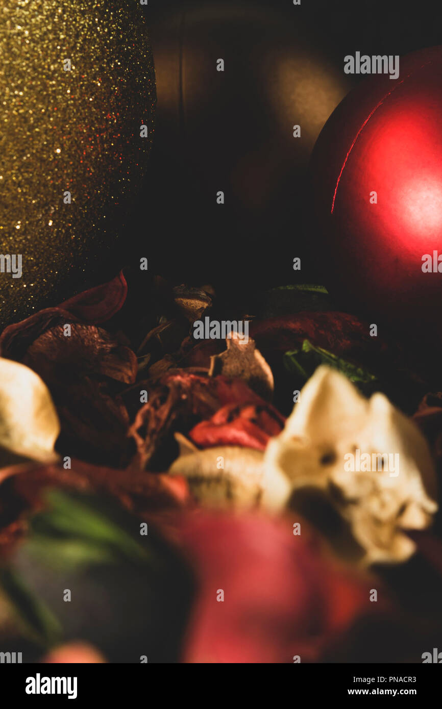 Close-up of Christmas baubles, glitter and matte, decorations and potpourri, toned image, muted colors, great for backgrounds. Stock Photo