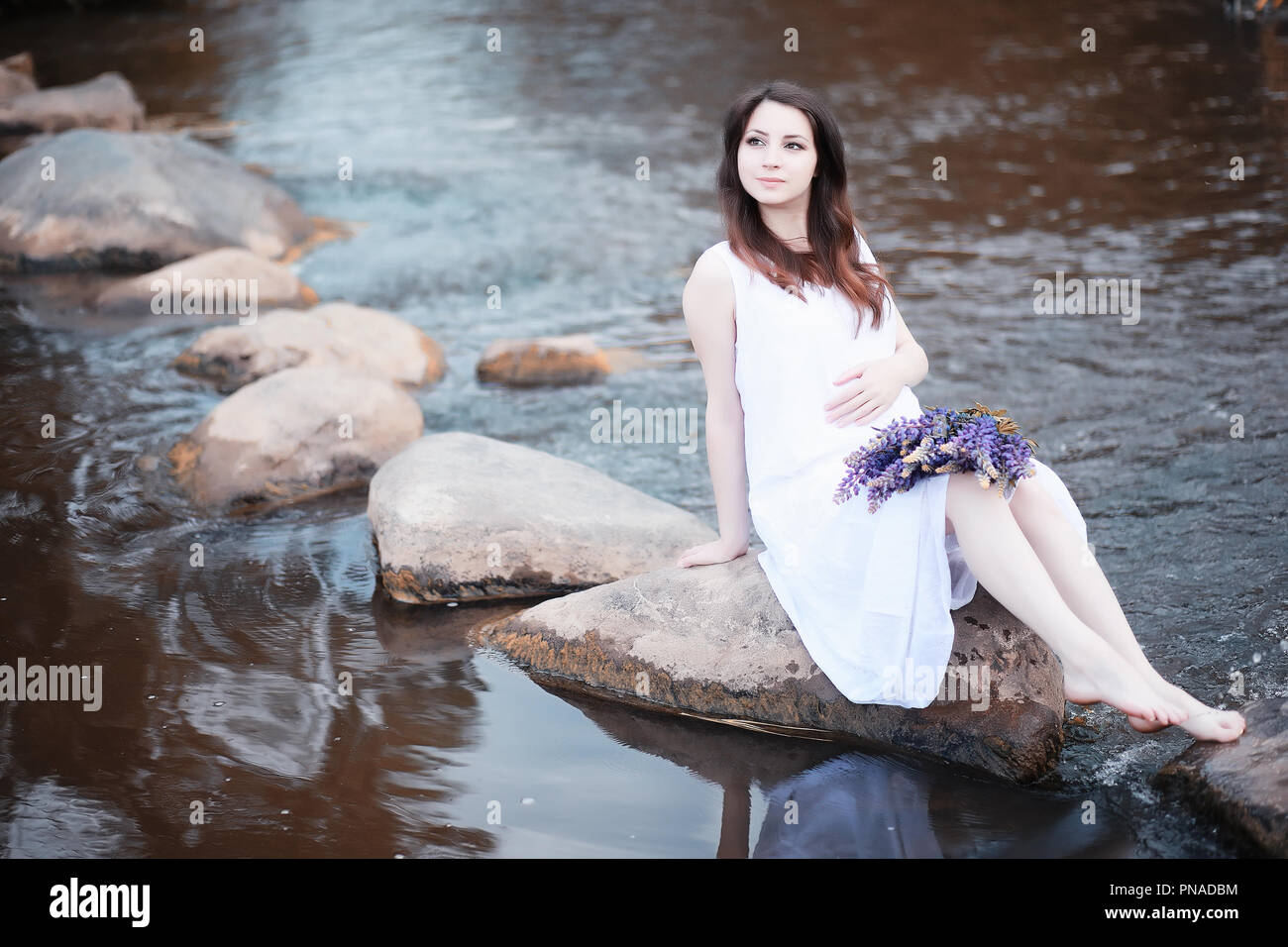 Pregnant woman in nature for a walk in the autumn Stock Photo - Alamy