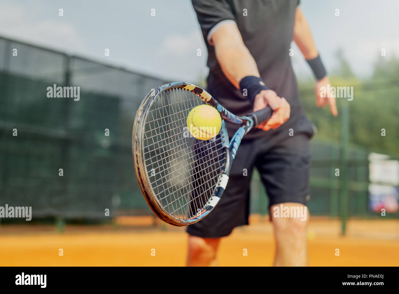 Tennis ball hitting racket close up hires stock photography and images