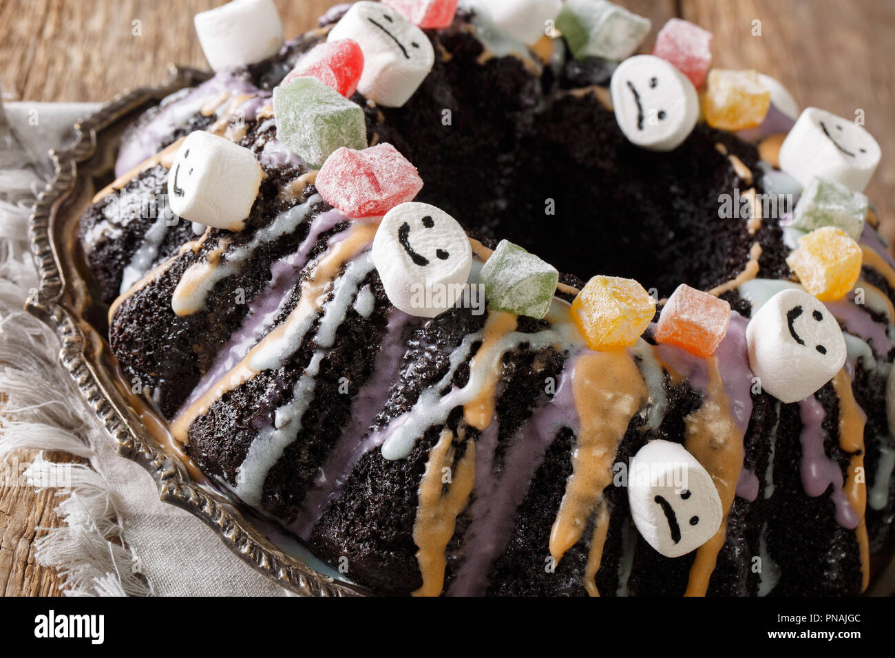 Halloween Black Bundt Cake Decorated With Candied Fruits